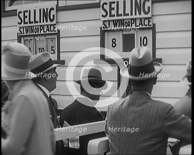 A Crowd of People Standing Outside a Totaliser/Tote Office at a Horse Race Course..., 1929. Creator: British Pathe Ltd.