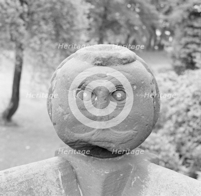 Carved Victorian stone head on a garden wall, Speke Hall, Liverpool, Merseyside, c1945-c1980. Artist: Eric de Maré.