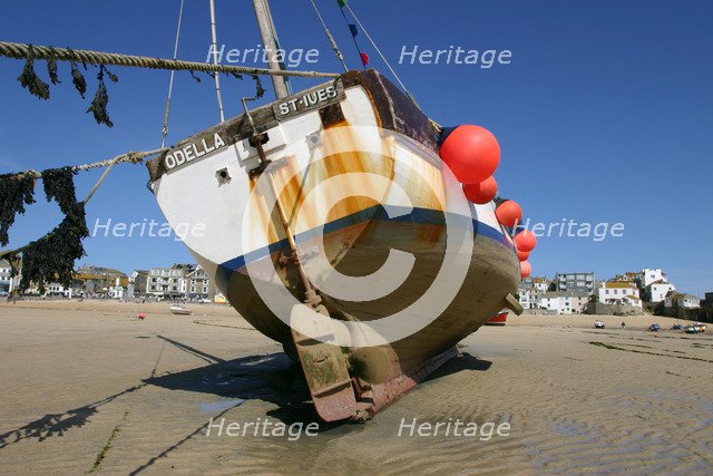 Fishing boat in the harbour at low tide, St Ives, Cornwall