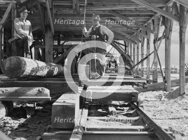 The sawmill carriage and log turner..., Ola self-help sawmill co-op, Gem County, Idaho, 1939. Creator: Dorothea Lange.