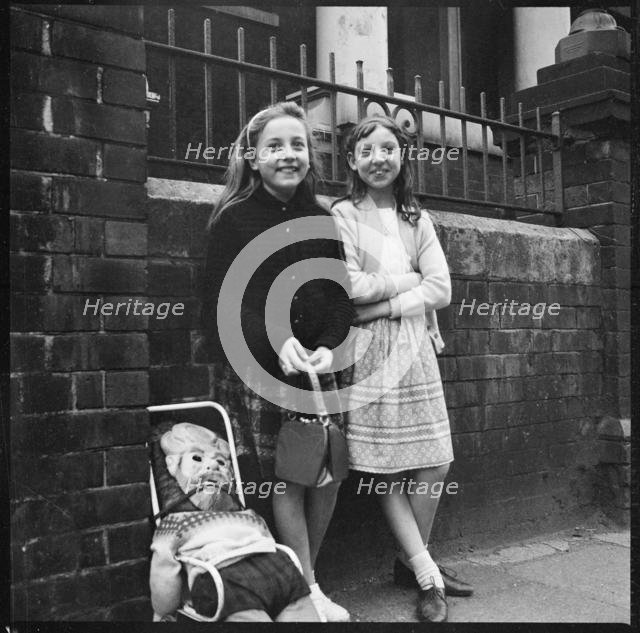 Two girls collecting 'pennies for the guy', Westport Road, Burslem, Stoke-on-Trent, 1965-1968. Creator: Eileen Deste.
