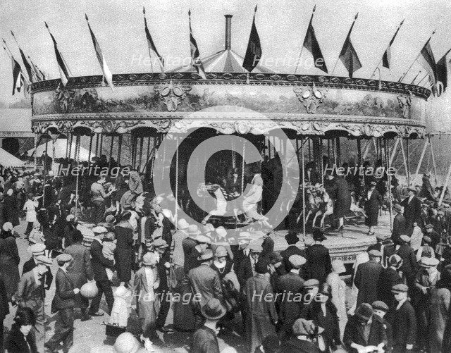 A merry-go-round, part of a bank holiday carnival on Hamstead Heath, London, 1926-1927. Artist: Unknown