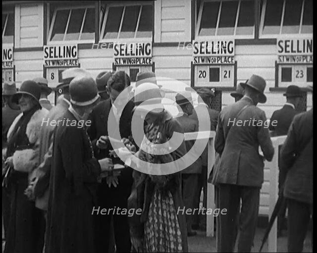 A Crowd of People Standing Outside a Totaliser/Tote Office at a Horse Race Course..., 1929. Creator: British Pathe Ltd.