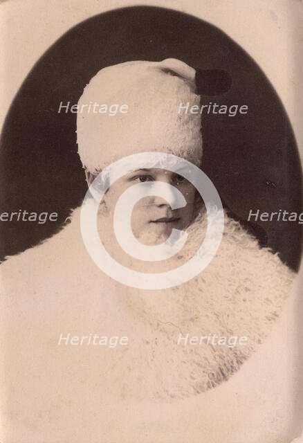 Young woman in winter clothes, late 19th cent - early 20th cent. Creator: Unknown.