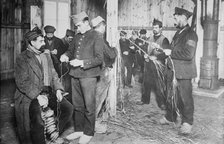 Prisoners at Zossen making straw shoes, 24 Feb 1915. Creator: Bain News Service.
