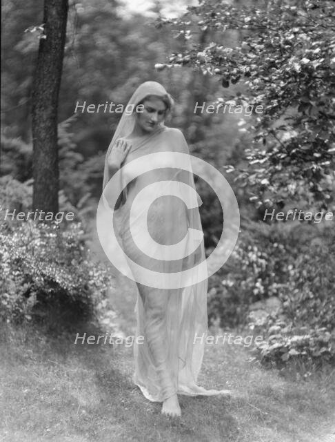 Egger, Gabrielle, Miss, standing outdoors, between 1926 and 1930. Creator: Arnold Genthe.