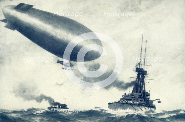 'Twixt Sea and Sky. British Airship Towed by Warship', 1917. Creator: Unknown.