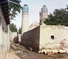 Passageway and three minarets topped with birds' nests, between 1905 and 1915. Creator: Sergey Mikhaylovich Prokudin-Gorsky.