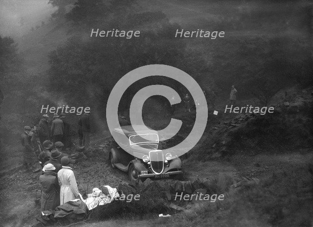 Ford V8 saloon of TC Wise competing in the MCC Sporting Trial, 1935. Artist: Bill Brunell.