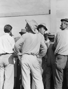 Watching ball game, Shafter migrant camp, California, 1939. Creator: Dorothea Lange.