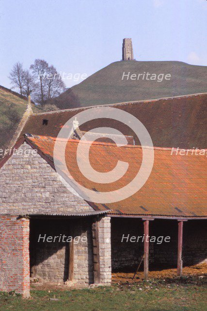 GlastonburyTor and ancient Tithebarn in foreground, Somerset, 20th century. Artist: CM Dixon.