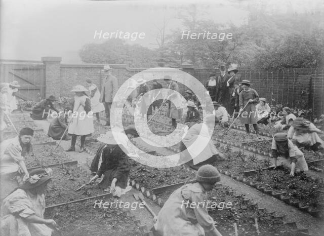 Lady Henry showing T.P. O'Connor over Children's Garden, 1913. Creator: Bain News Service.