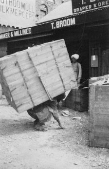 A porter lifting a large load, Chakrata, India, 1917. Artist: Unknown