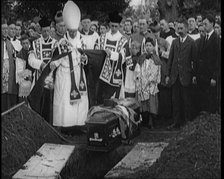 A Priest Waving Incense Over the Coffin of Terence MacSwiney During His Burial, 1920. Creator: British Pathe Ltd.