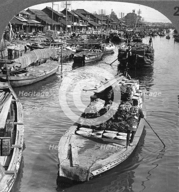 A busy freight canal in Tokyo, Japan, 1904.Artist: Underwood & Underwood