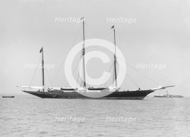 The three mast auxiliary sailing yacht 'Utopia' at anchor, 1913. Creator: Kirk & Sons of Cowes.