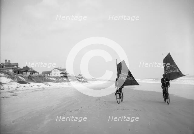 Sailing bicycles on the beach, Ormond, Fla., between 1900 and 1910. Creator: Unknown.