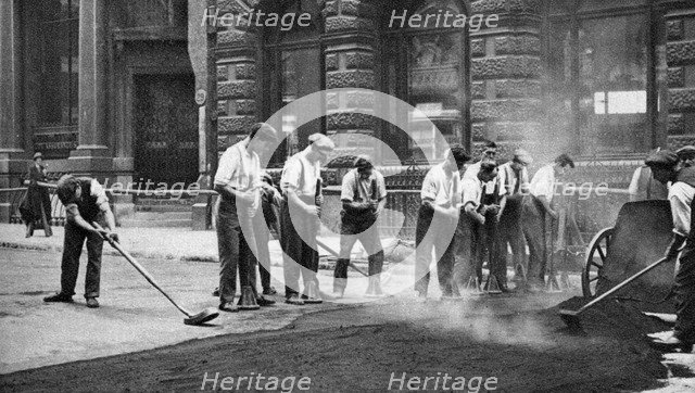 Workmen laying tar and asphalt in Cornhill, London, 1926-1927. Artist: McLeish