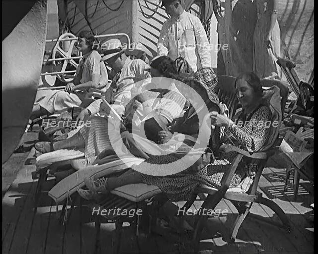 People Sitting on Deck Chairs on the Deck of a Cruise Liner Whilst at Sea, 1931. Creator: British Pathe Ltd.