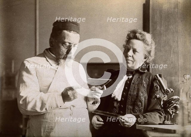Professor and Mrs Dejerine looking at a microscopic sample of the human brain, c1900s. Creator: Unknown.