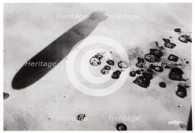 Aerial view of a desert settlement, with a shadow cast by a Zeppelin, 1931 (1933). Artist: Unknown