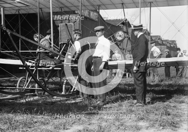 W.R. Kimball & aeroplane, between c1910 and c1915. Creator: Bain News Service.
