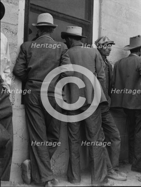Waiting for the relief checks at Calipatria, California, 1937. Creator: Dorothea Lange.
