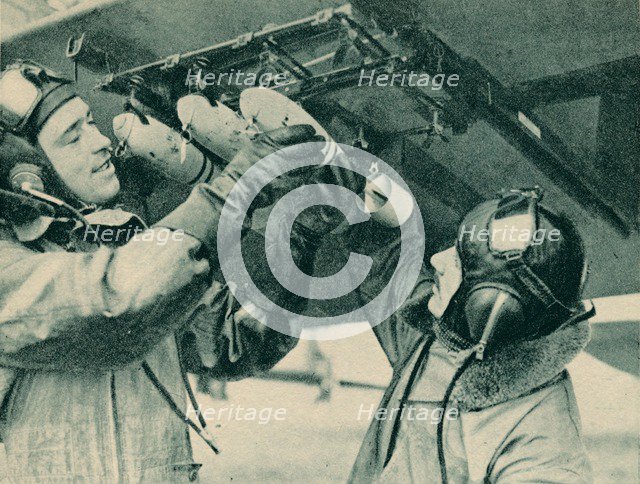 Air observer receiving bombing training, 1940. Artist: Unknown