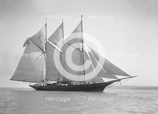 The three-mast auxiliary schooner 'Invincible', 1911. Creator: Kirk & Sons of Cowes.