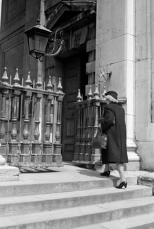 Woman entering the church of St Martin in the Fields, London, c1950. Artist: SW Rawlings