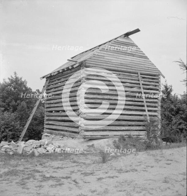 Log cabin barn under construction, near Concord, Person County, North Carolina, 1939. Creator: Dorothea Lange.