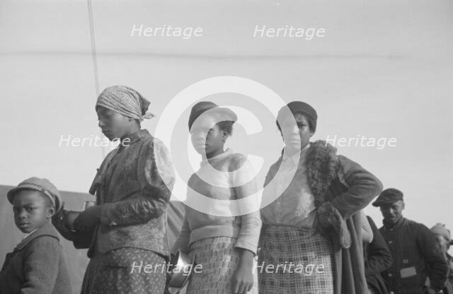 Possibly: Negroes in the lineup for food at meal time in the camp..., Forrest City, Arkansas, 1937. Creator: Walker Evans.