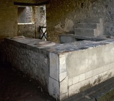 Thermopolium, commercial establishment (restaurant), Herculaneum, Italy, 2002.  Creator: LTL.