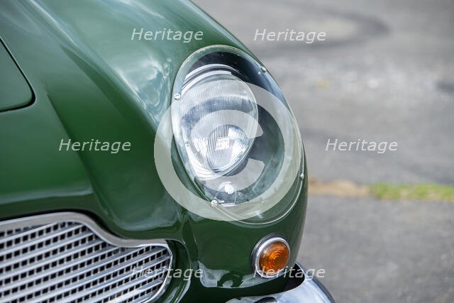 Left front headlight of a 1961 Aston Martin DB4 GT previously owned by Donald Campbell. Creator: Unknown.
