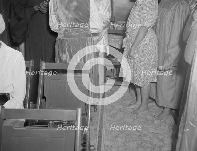 As in Moses' time, members of the St. Martin's Spiritual Church remove...Washington, D.C., 1942. Creator: Gordon Parks.