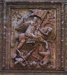 Yuso Monastery. High relief on the porch, with a scene of San Millán on horseback fighting the Ar…