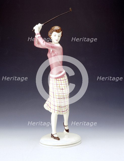 Ceramic figurine of a lady golfer, c1920s. Artist: Unknown