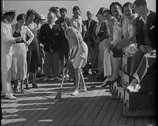 People Enjoying Games on Deck of a Cruise Liner Whilst at Sea, 1931. Creator: British Pathe Ltd.