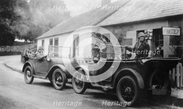 Two Austin Sevens parked outside a small tea shop, c1925. Artist: Unknown