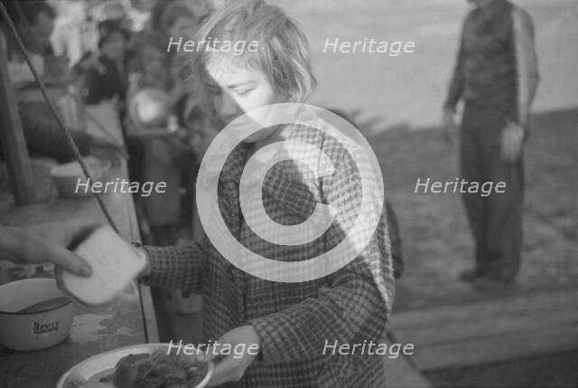 Possibly: Negroes in the lineup for food at mealtime in the camp..., Forrest City, Arkansas, 1937. Creator: Walker Evans.