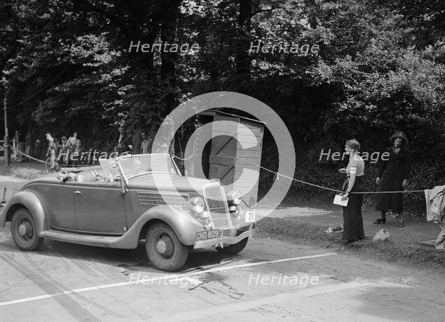 DJH Currie's Ford V8, winner of a silver award at the MCC Torquay Rally, July 1937. Artist: Bill Brunell.