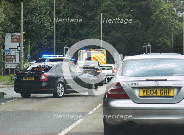 Ambulance attending road traffic accident, A35 Hampshire 2017. Creator: Unknown.
