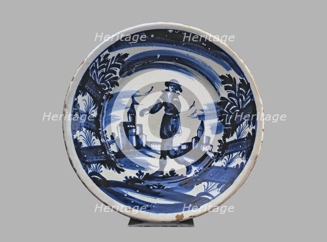 Blue plate with man and buildings, typical Catalan ceramics.