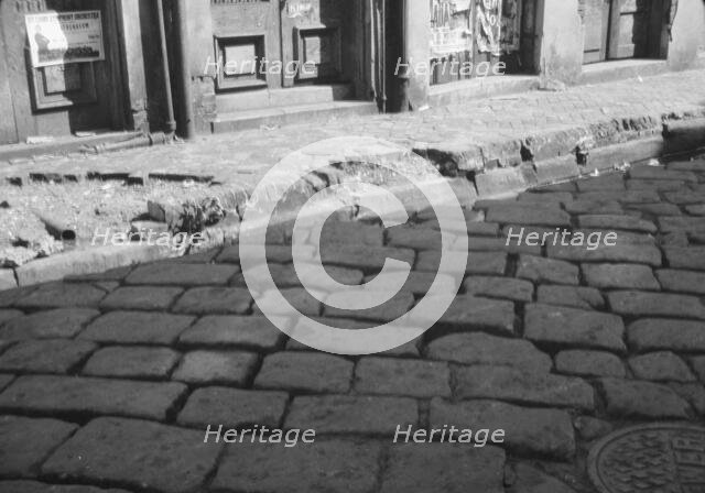 Old pavement blocks, New Orleans, between 1920 and 1926. Creator: Arnold Genthe.
