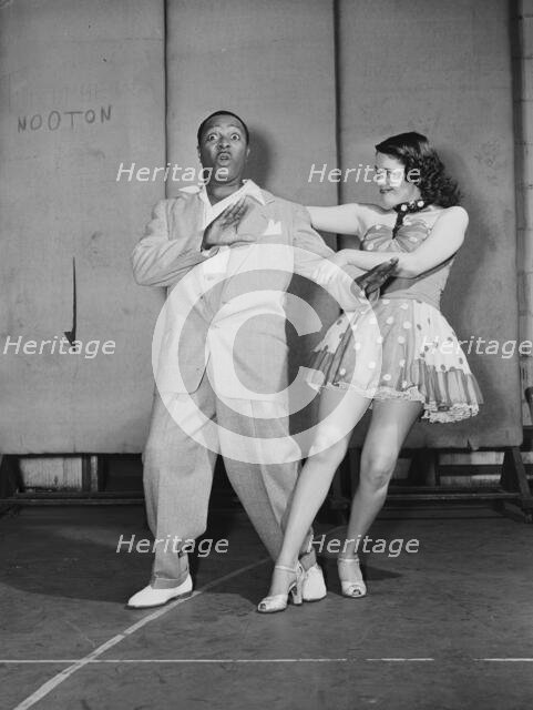 Portrait of Louis Jordan, Paramount Theater(?), New York, N.Y., ca. July 1946. Creator: William Paul Gottlieb.