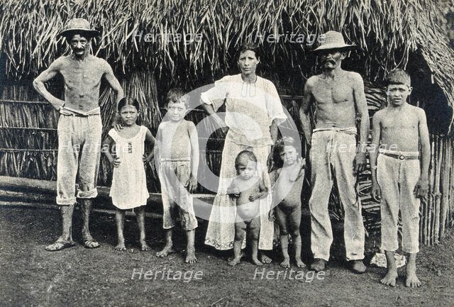 Panama Indian family outside a traditional hut,  1900/1910. Creator: Unknown.