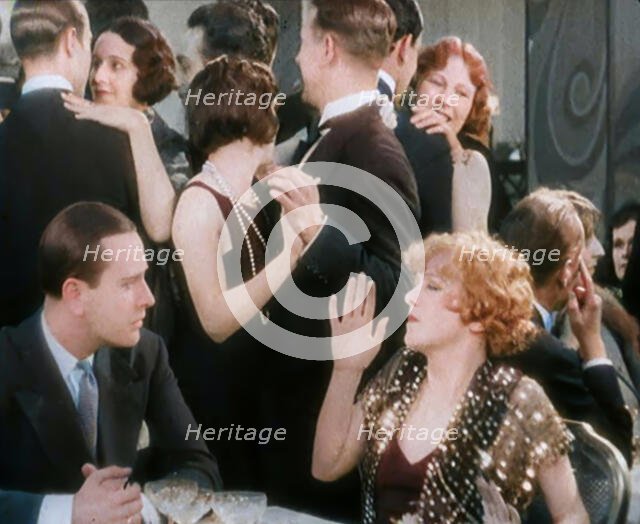 Scene from the Film 'Champagne': Betty Balfour in a Nightclub Drinking Champagne and..., 1920s. Creator: British Pathe Ltd.