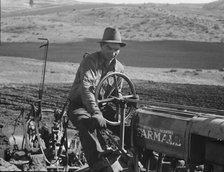 Young Idaho farmer plowing...Ola self-help sawmill co-op..., Gem County, Idaho, 1939. Creator: Dorothea Lange.