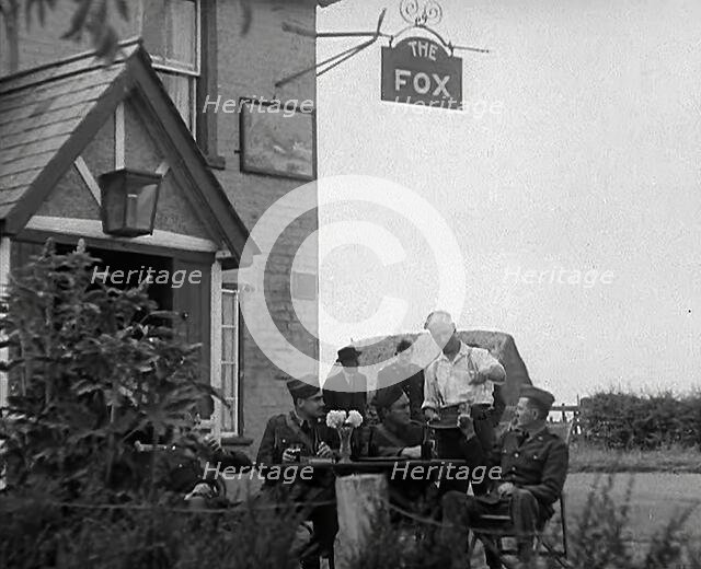 American Airmen Drinking Outside a Public House in England, and Being Served by the..., 1943-1944. Creator: British Pathe Ltd.