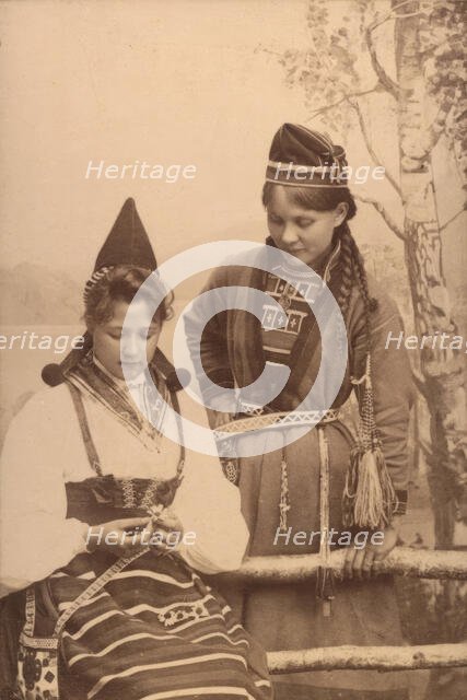 Studio portrait: two women in national costume, 1906.  Creator: Helene Edlund.